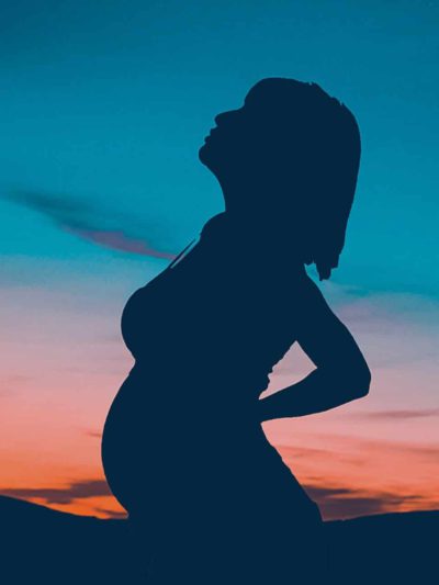 CBD Oil for pregnancy woman sunset