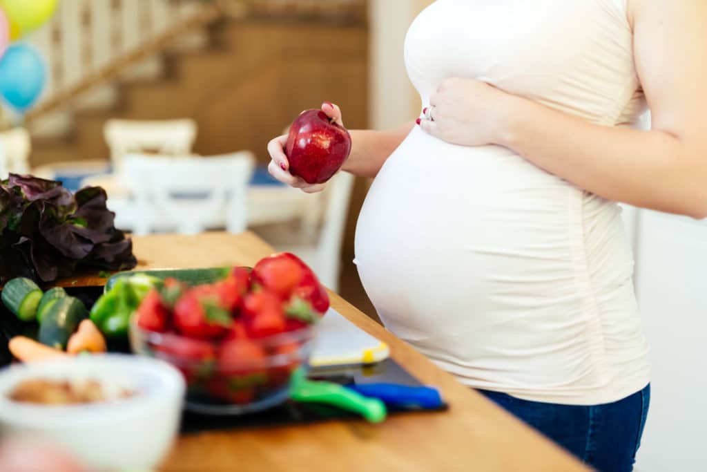 CBD and pregnancy woman choosing snack