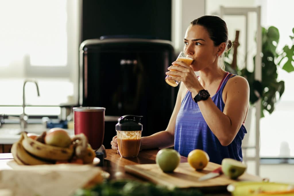 Young woman drinking CBD for weight loss