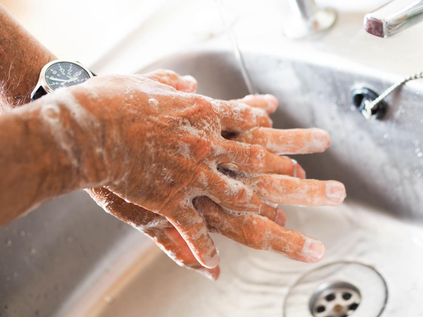 Person washing their hands. OCD and CBD