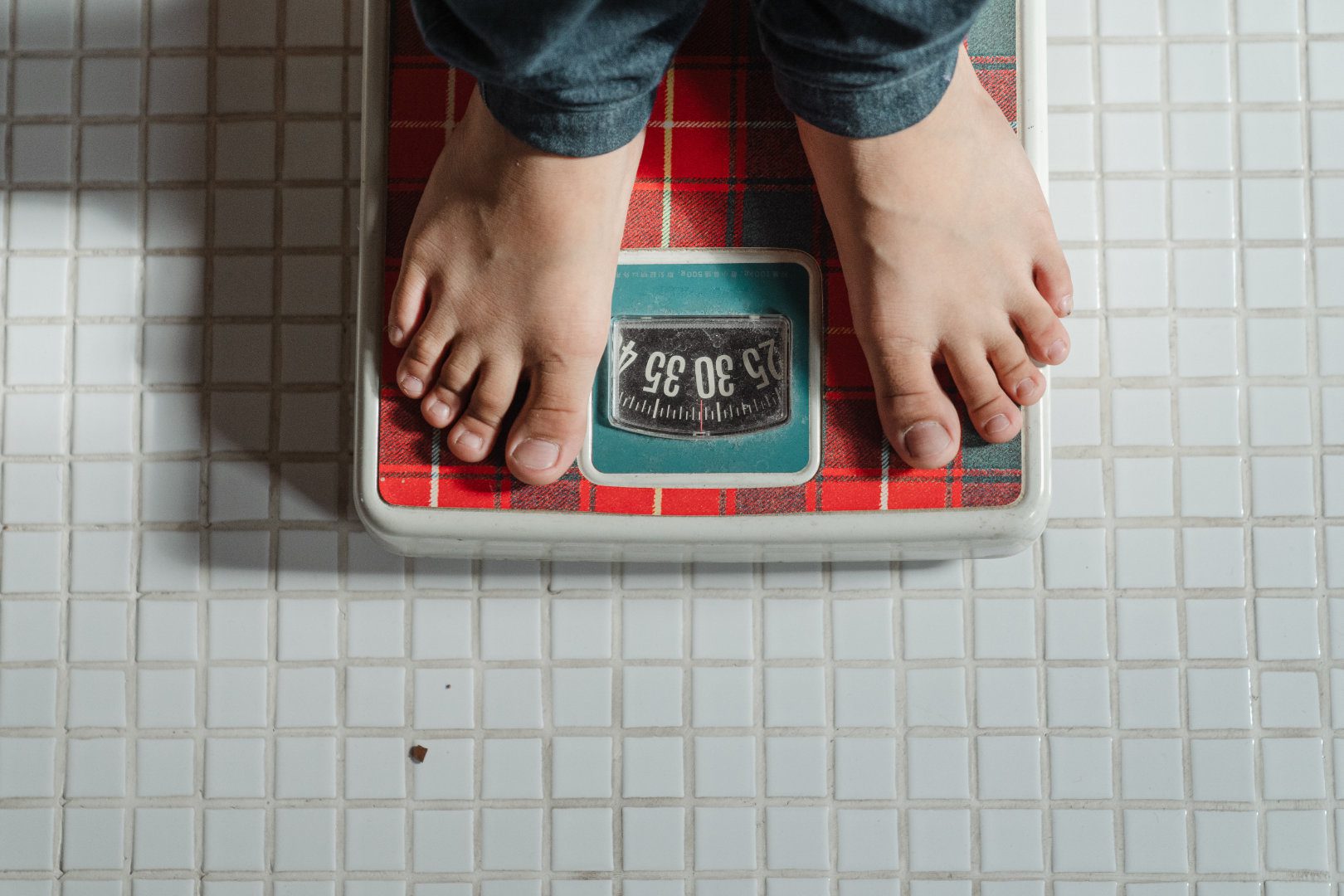 Person standing on a weight scale