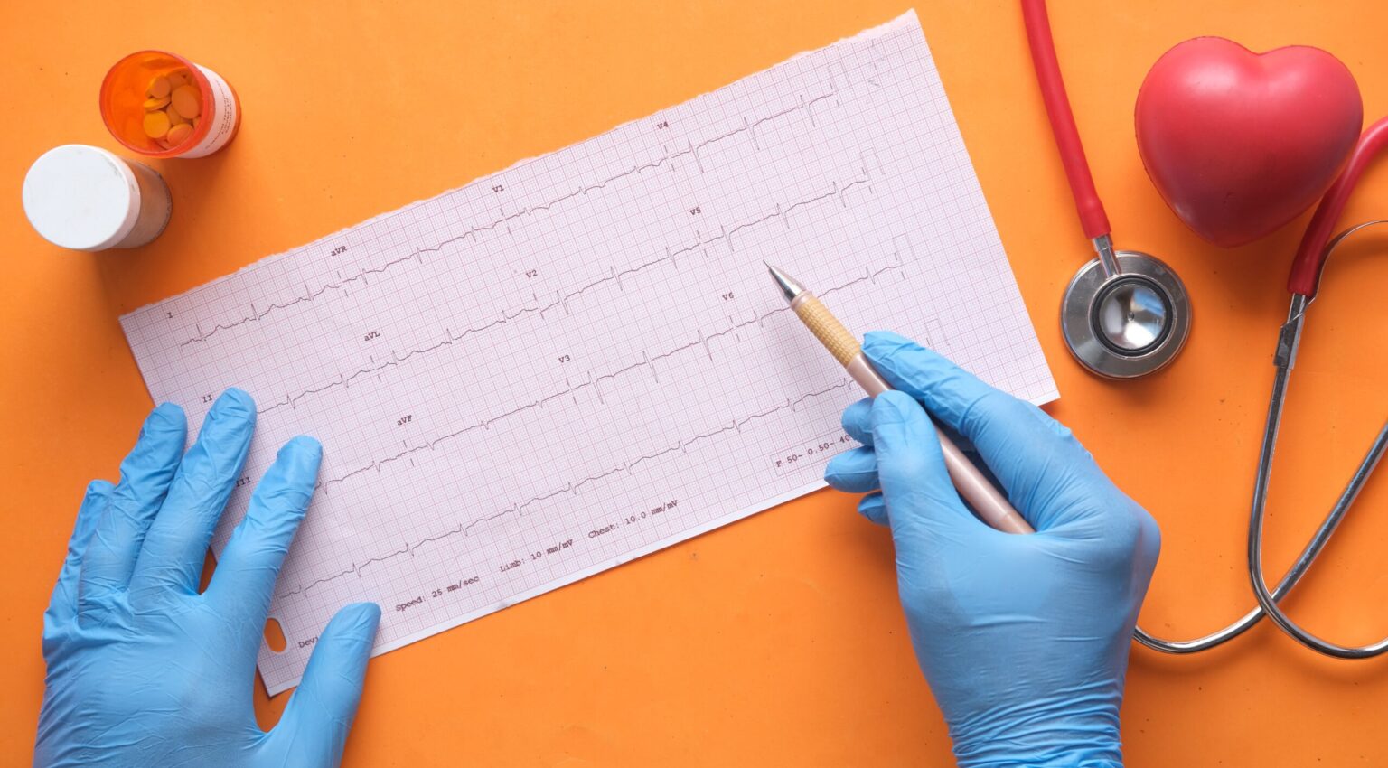 A doctor analyzing heart rate medical records