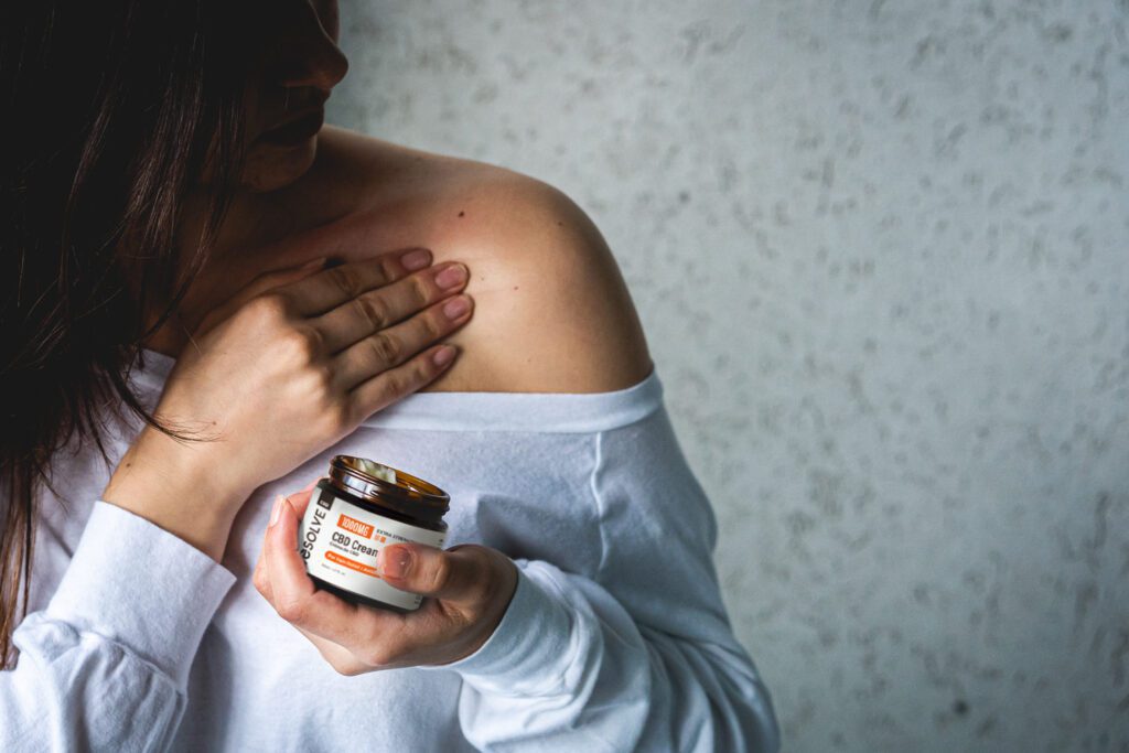 Applying CBD cream for pain relief in Canada