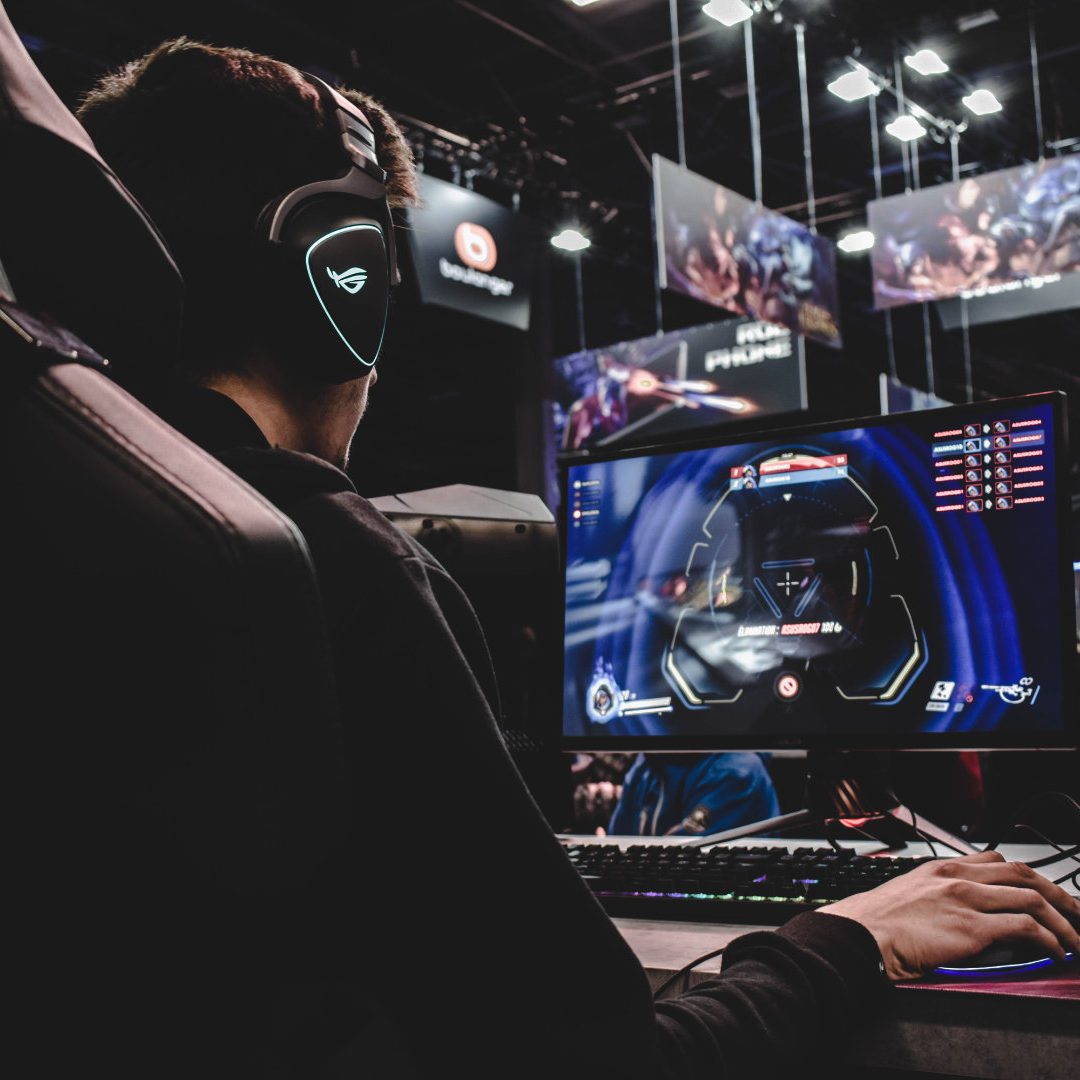 Person palying video games in arena competition