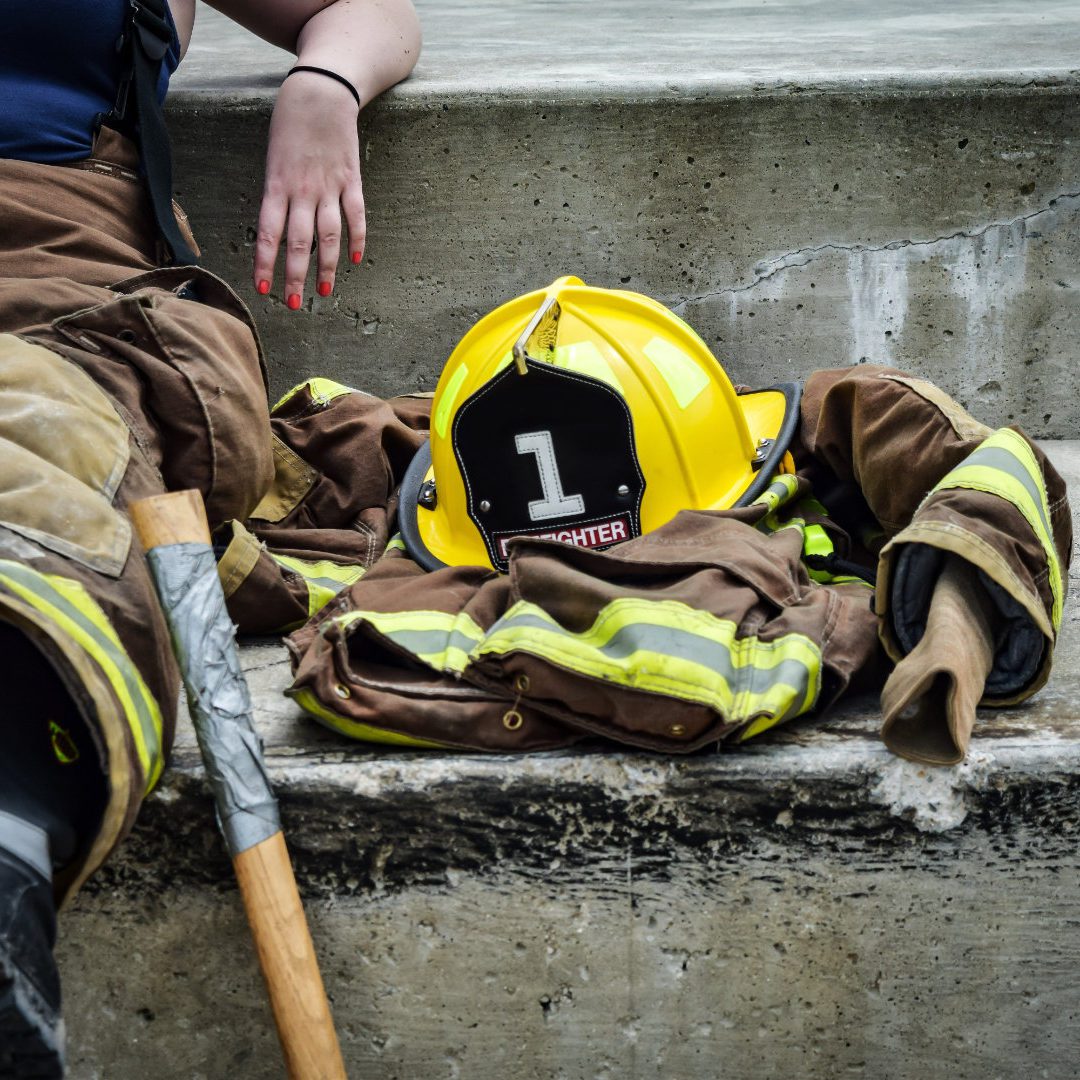 Fire fighter laying down exhausted